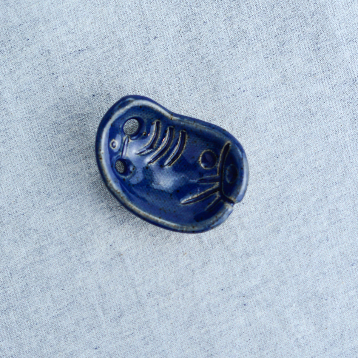 Miniature ceramic sculpture, curved for use as a handheld worry stone