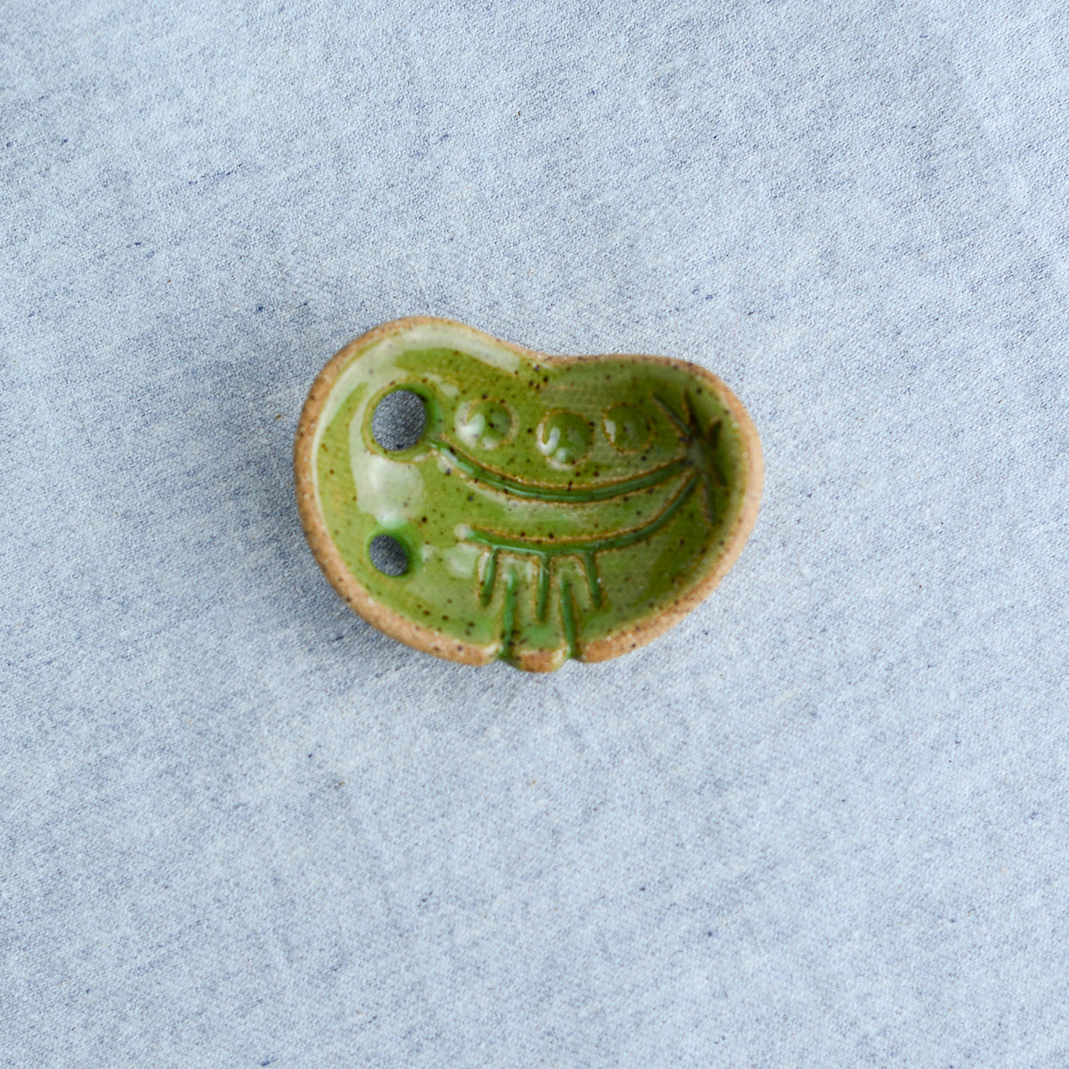 Miniature ceramic sculpture, curved for use as a handheld worry stone