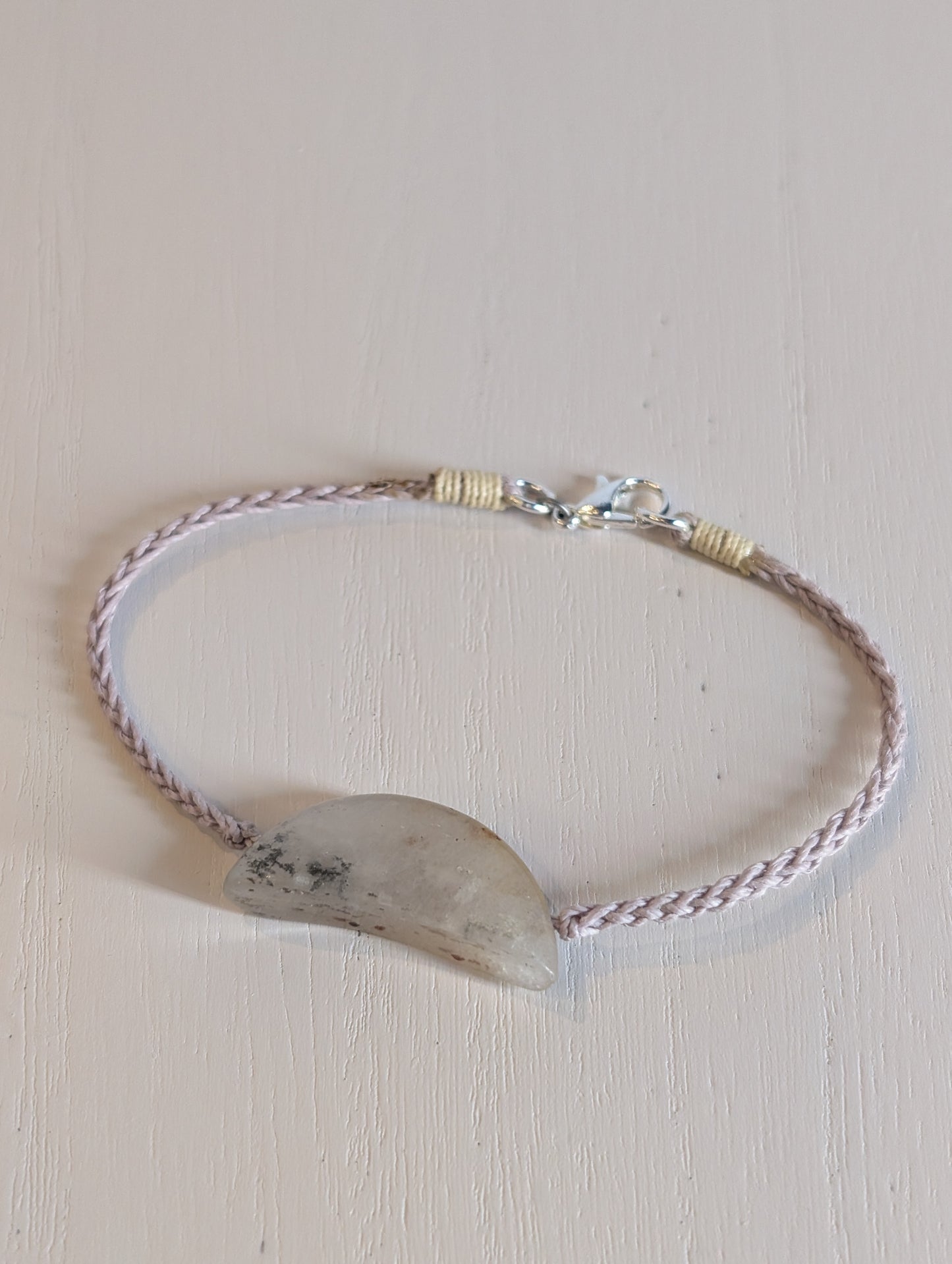 Bracelet with a natural stone on a light background