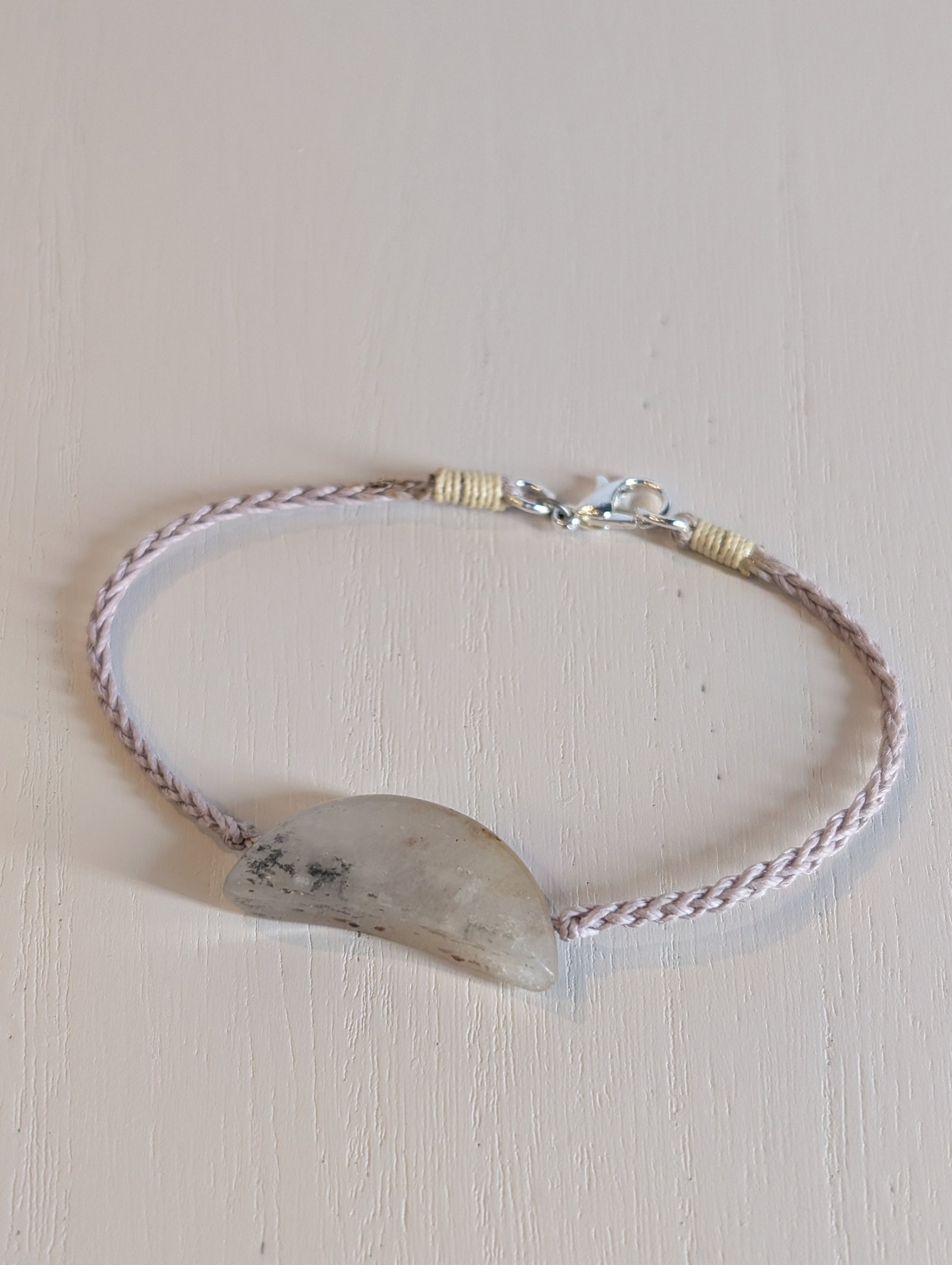 Bracelet with a natural stone on a light background