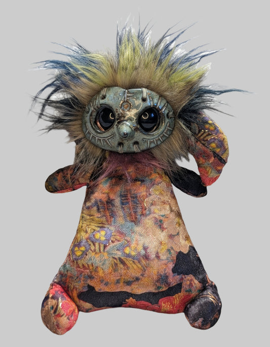 A one of a kind artists' doll with a plush body, wild hair, and ceramic face