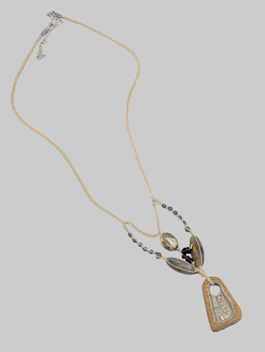 micro macrame hand knotted necklace with glass and stone beads and a hand carved ceramic focal