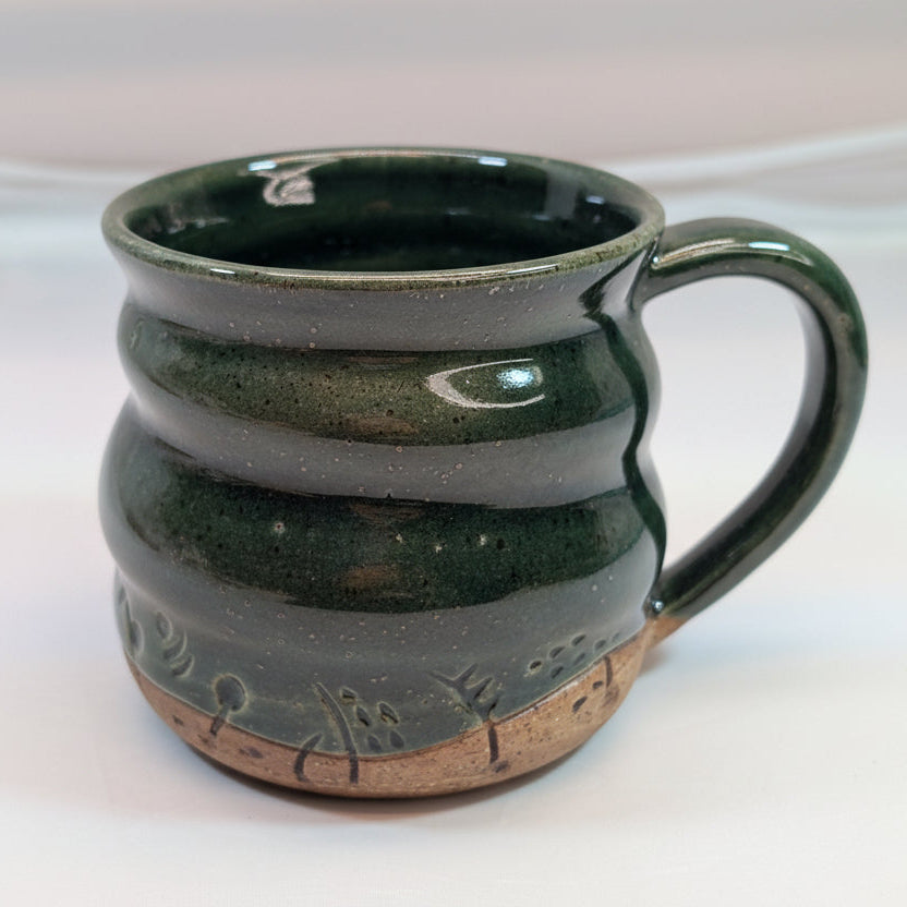 hand carved deep green celadon glaze warbly mug
